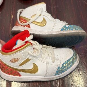Nike White Sneakers with Gold, Red, and Blue Accents